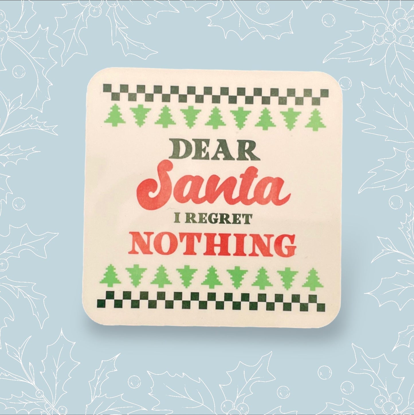 Square coaster with ‘Dear Santa, I regret nothing’ on it in the style of a Christmas jumper