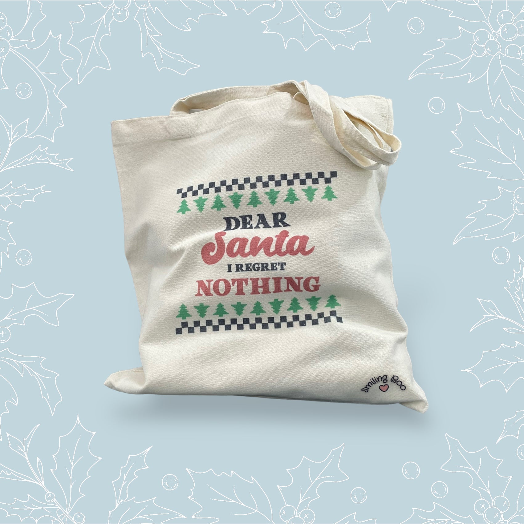 Canvas tote bag with ‘Dear Santa, I regret nothing’ on it in the style of a Christmas jumper