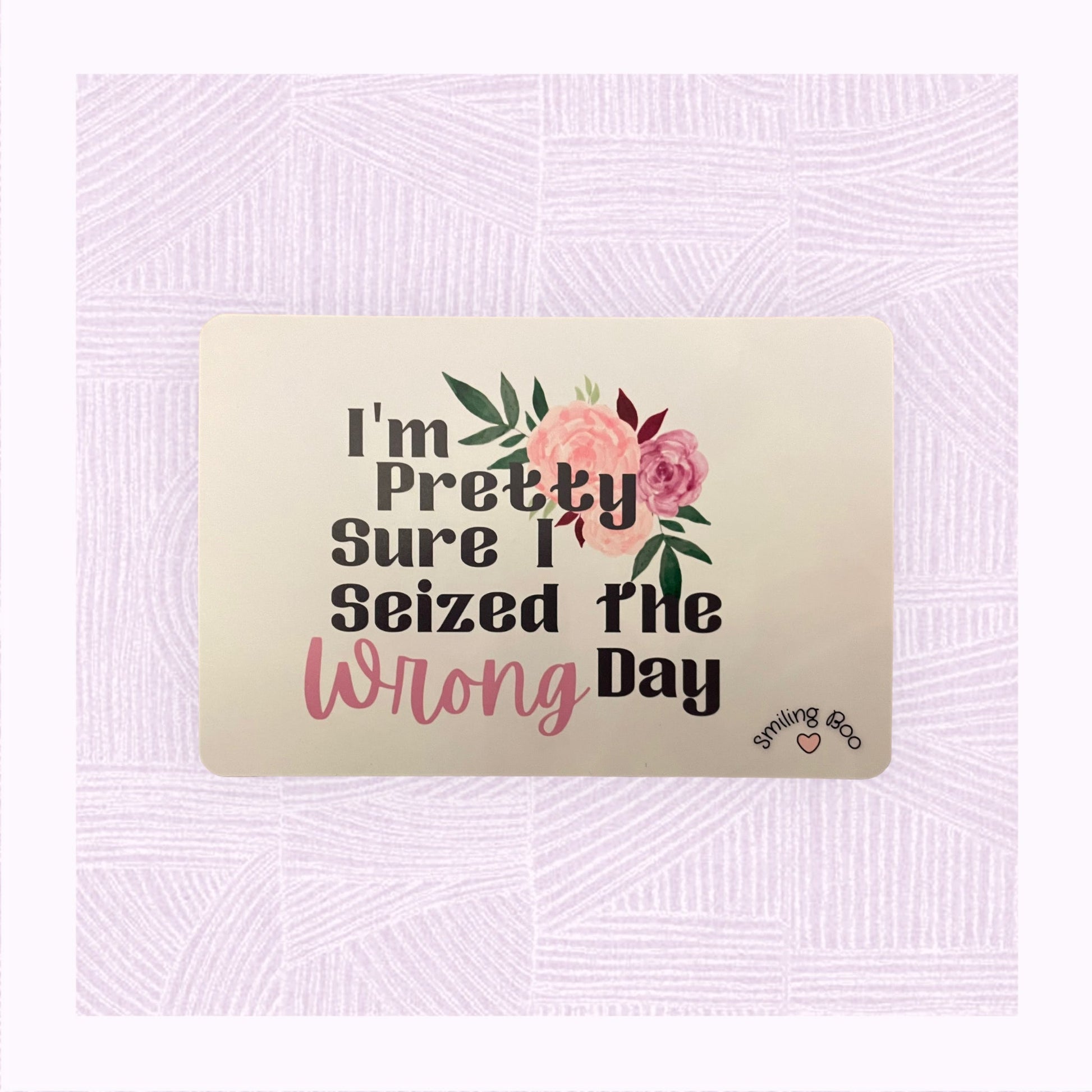 Postcard art print with a pastel pink/peach watercolour background with the phrase ‘I’m pretty sure I seized the wrong day’ and floral arrangement