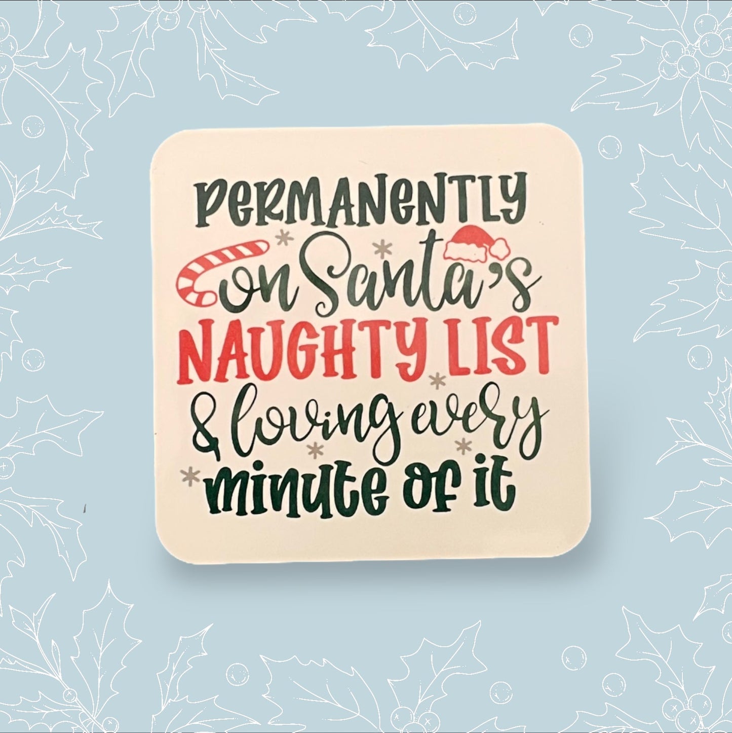 Square coaster with ‘Permanently on Santa’s naughty list and loving every minute of it in black and red embellishments