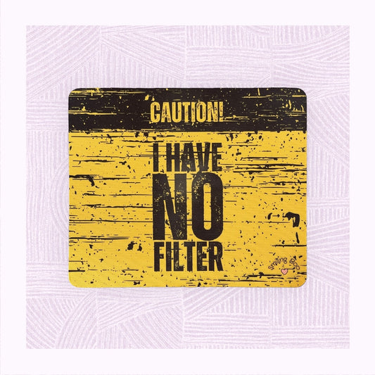 Rectangle mouse mat with a yellow and black distressed background, with the phrase ‘Caution! I Have No Filter’.