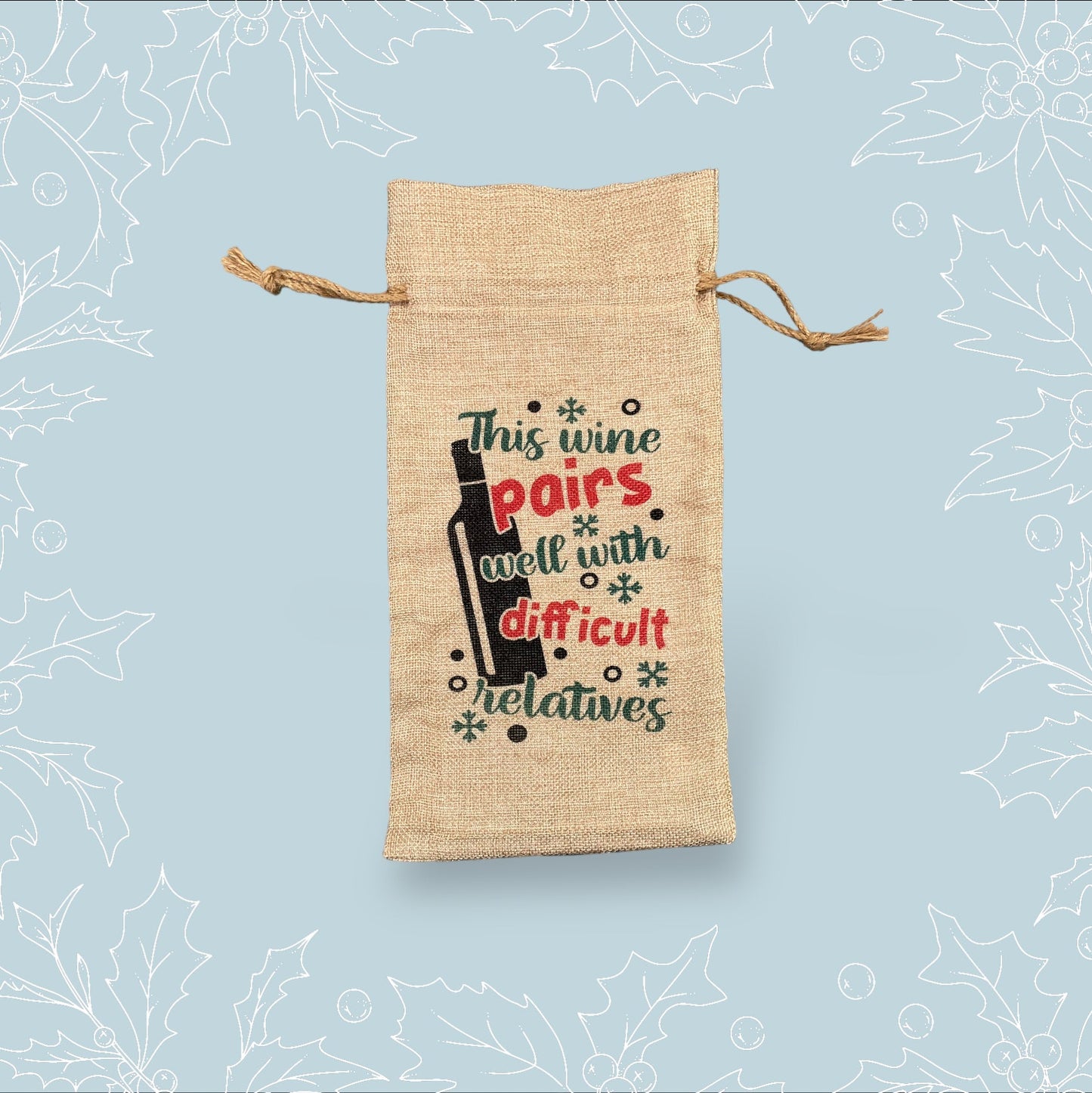A burlap bottle bag with the phrase ‘This wine pairs well with difficult relatives’