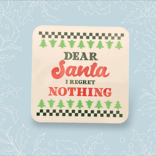 Square coaster with ‘Dear Santa, I regret nothing’ on it in the style of a Christmas jumper