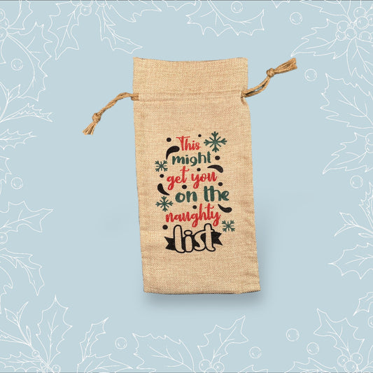 A burlap bottle bag with the phrase ‘This might get you on the naughty list’
